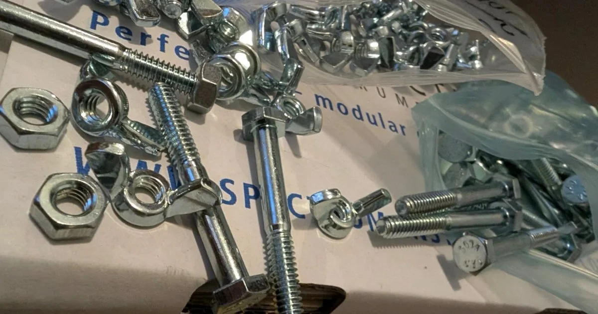 Assorted Hex Bolts, Wing Nuts, and Hex Nuts selling as lot never used